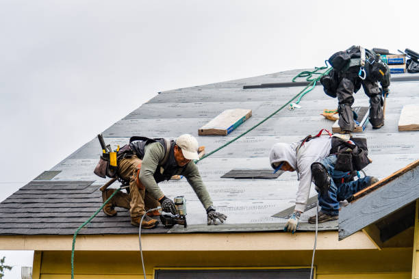 Professional Storm Damage Roof Repair technician working in Bondurant, IA